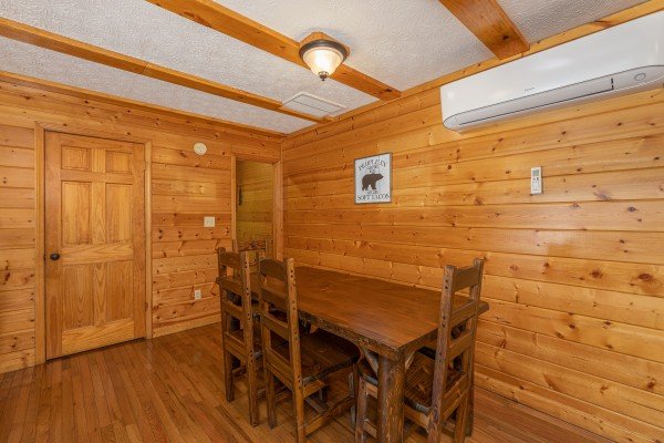 Dining table at Pool Side Lodge, a 6 bedroom cabin rental located in Pigeon Forge